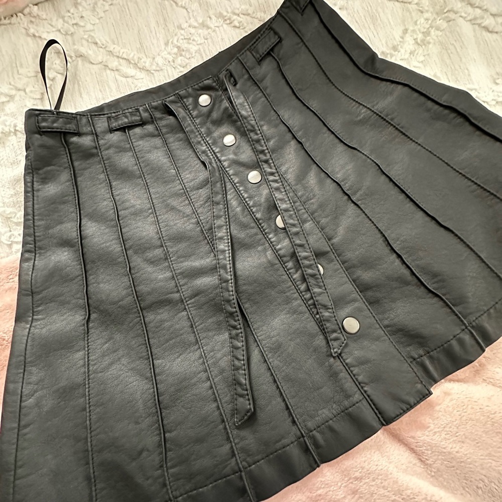 Free people black pleather skirt with pleats, button down and tie.